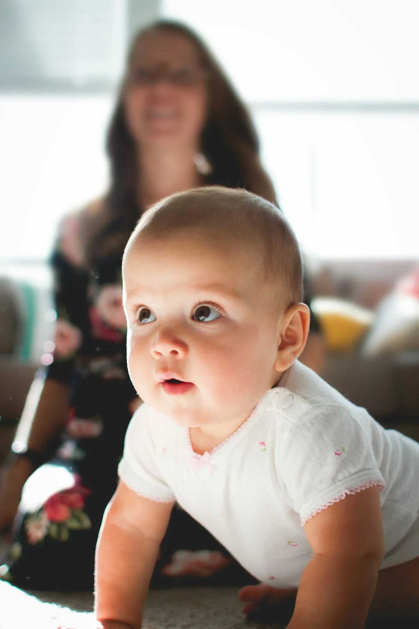 A baby looking up, curious